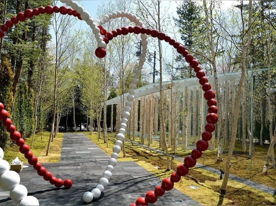 kengo kuma combines tree trunks and glass for the birch moss chapel in japan