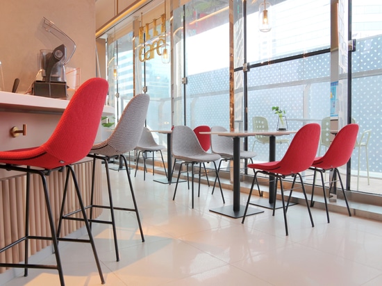 Ta Up Chairs by TOOU, surrounded by the colored atmosphere of the Elle Café in Shanghai.