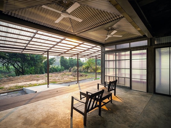 junsekino builds a translucent library for community in rural thailand