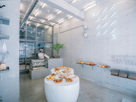 fathom designs japanese bakery ripi as a continuous space of concrete and glass