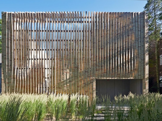 the façade of this house in chicago boasts an array of twisting brick columns