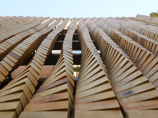 the façade of this house in chicago boasts an array of twisting brick columns