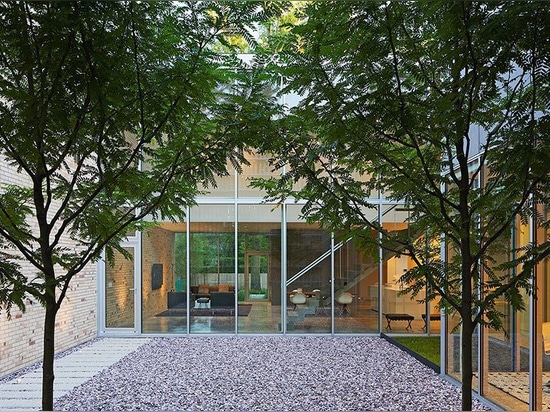 the façade of this house in chicago boasts an array of twisting brick columns