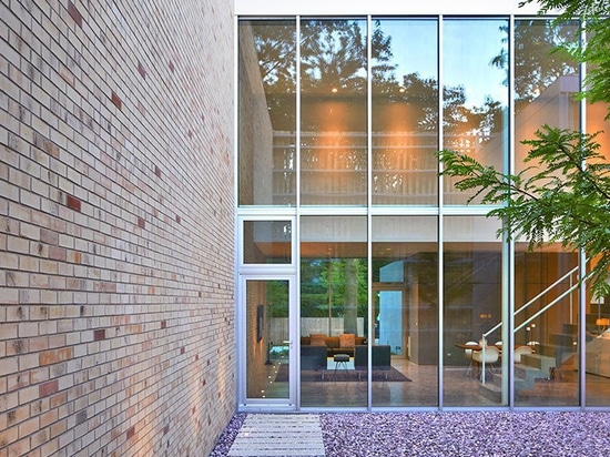 the façade of this house in chicago boasts an array of twisting brick columns