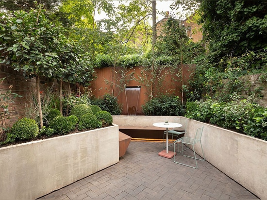 A Rear Extension With A Pivoting Glass Door Has Been Added To This London Home