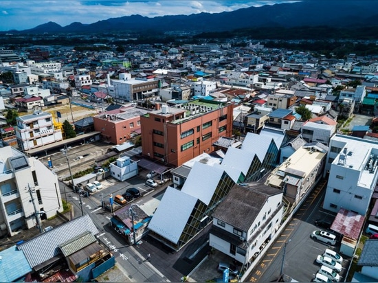 tezuka architects designs tomioka town hall with a distinctive jagged roofline