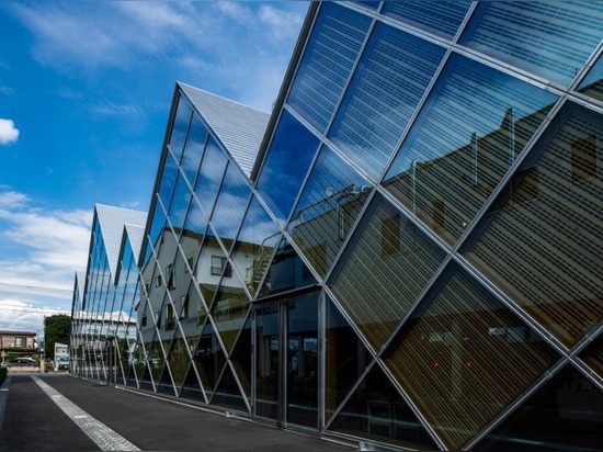 tezuka architects designs tomioka town hall with a distinctive jagged roofline