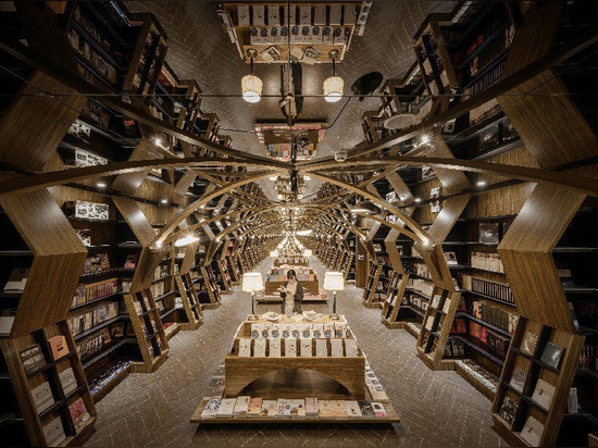 x+living combines wooden structures and mirrors in mesmerizing chinese bookstore