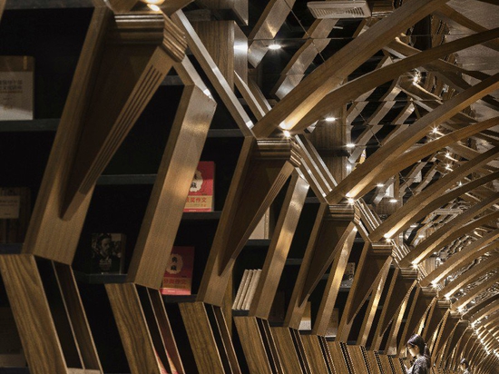 x+living combines wooden structures and mirrors in mesmerizing chinese bookstore