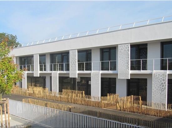 Architectural facade, sun visor and privacy screen made of perforated sheets.