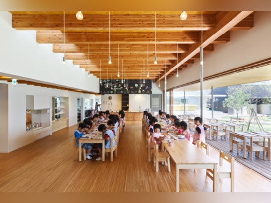 Light-filled classrooms surround a courtyard garden at DS Nursery in Japan