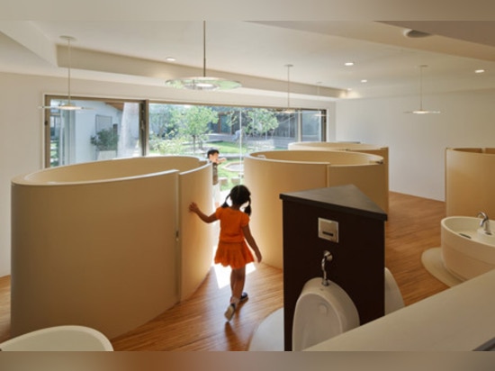 Light-filled classrooms surround a courtyard garden at DS Nursery in Japan