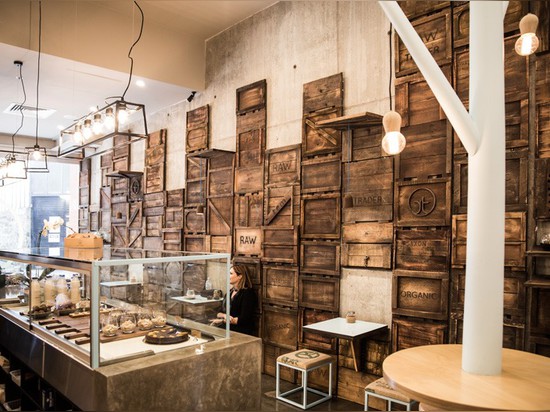 StudioY Design A Raw Dessert Bar Featuring Man-Made Trees And A Wall Of Rustic Produce Crates