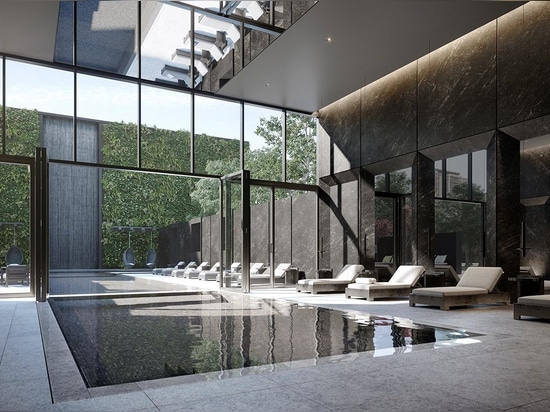 The rectilinear indoor/outdoor pool area is a break from the building’s zagging exterior.