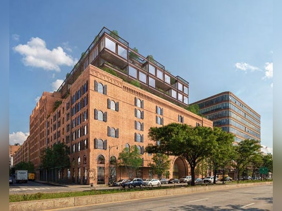 Street level view of the warehouse with the office addition visible at the top of the structure.