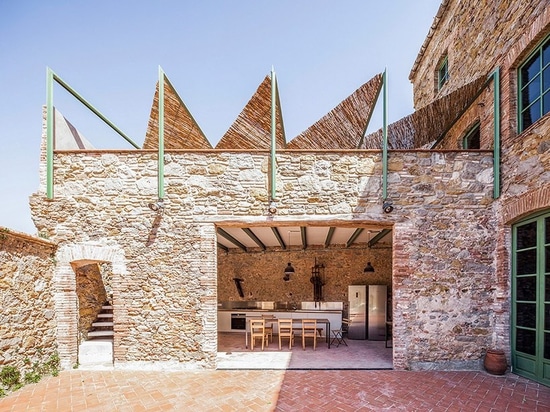 Anna & Eugeni Bach transform former chocolate factory in Spain into a warm, luminous oasis