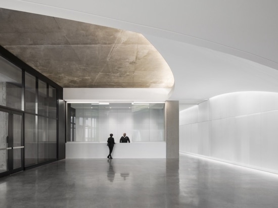 The entrance and lobby at Montreal Tower mimics the swooping form of Roger Taillibert’s stadium design.