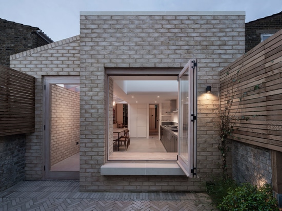 Oliver Leech Architects uses soft colours to create bright and airy kitchen extension