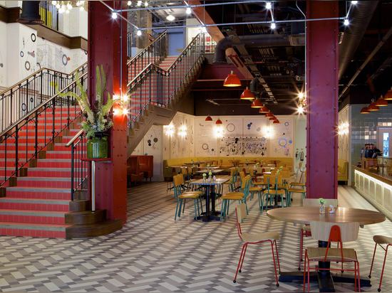 A vast oak-clad, red-tiled staircase leads from the double-height foyer on the ground level, up to the first floor