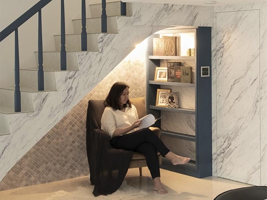 A Small Reading Nook Under The Stairs Makes Use Of An Otherwise Awkward Space