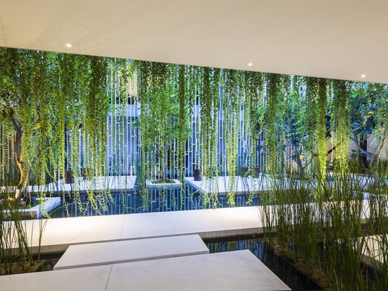 Lush living plants engulf the green-roofed Pure Spa in Vietnam