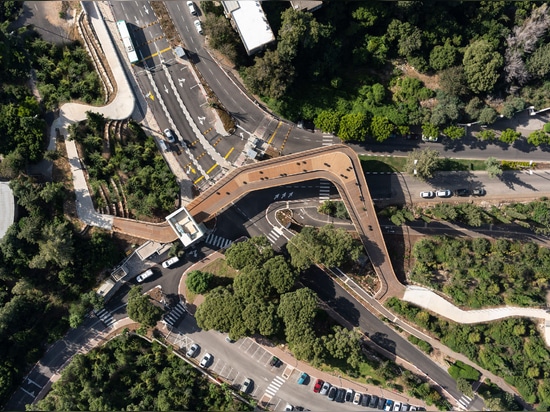 The bridge is elevated over a busy road