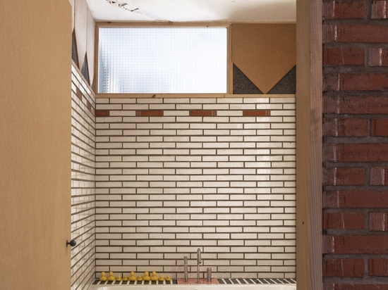 Glazed bricks line the wet areas and bathrooms