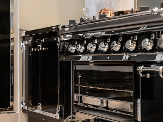 GLOSS JET BLACK AND POLISHED CHROME WITH LIGHT OAK CABINETS