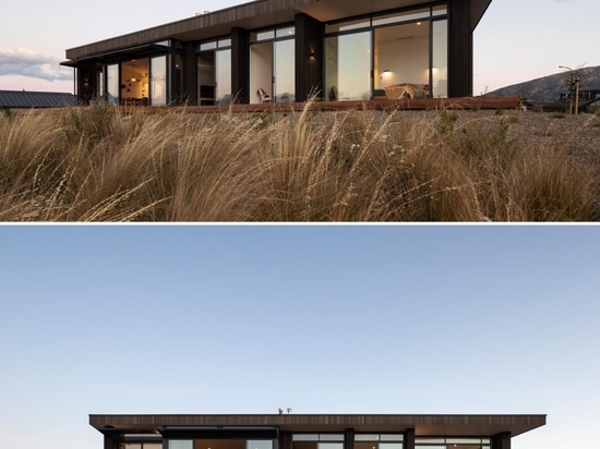 Dark Vertical Wood Siding On The Exterior Of This Modern House Gives It A Strong Personality