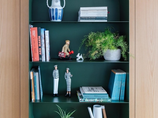 The Shelving In This Apartment Creates A Prominent Display Of Collectibles And Curios