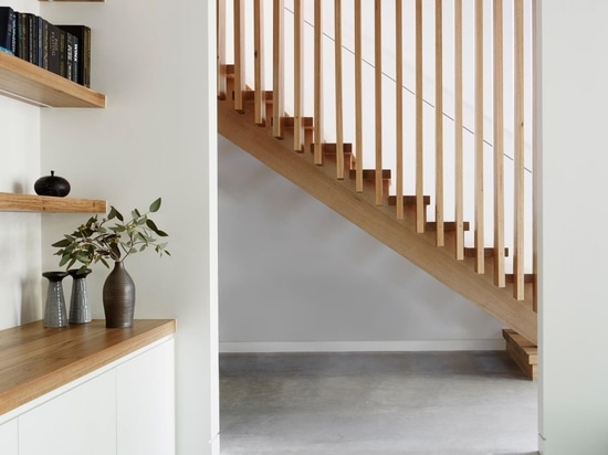 An Exterior Of Blackbutt Timber Hides The Bright White Interior Of This Home