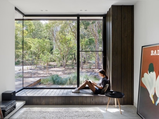 An Exterior Of Blackbutt Timber Hides The Bright White Interior Of This Home