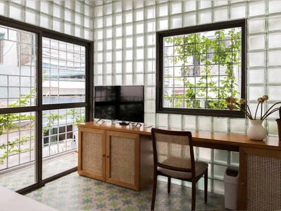 ROOM+ Design & Build replaces walls of house in Ho Chi Minh City with glass bricks