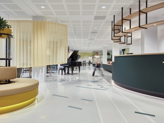 A grand piano sits in the lobby