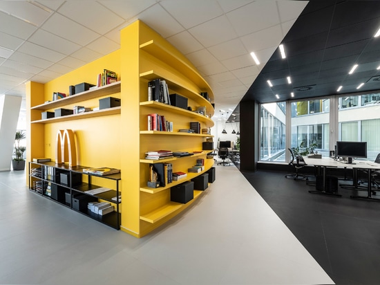 A yellow "war room" punctuates the open-plan office