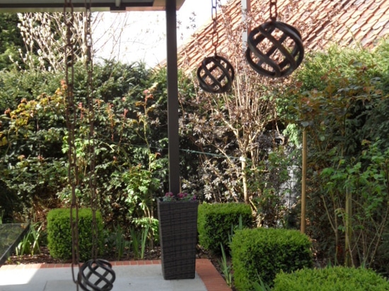 Outdoor living room with bioclimatic pergola  in a country house in England