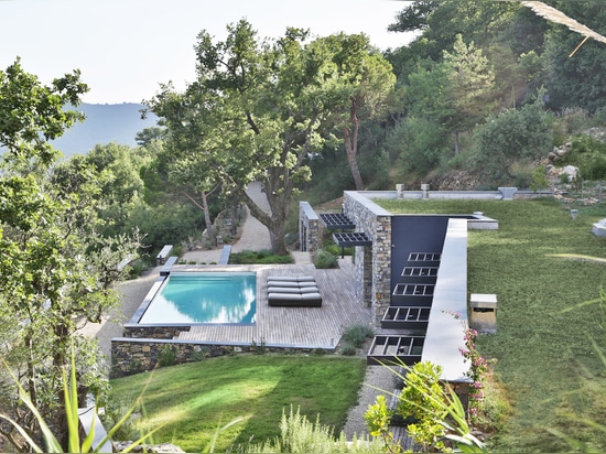 The house is set into the landscape.