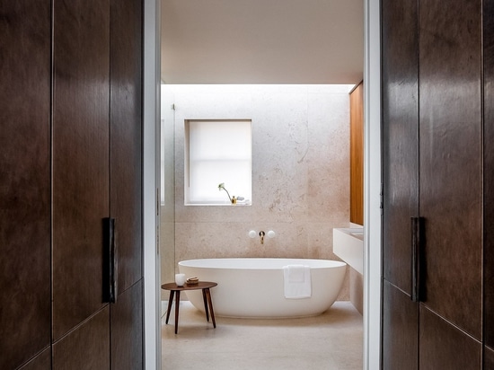 Sliding doors lead into the master bathroom