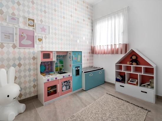 A Small Desk Was Included In This Wrap Around Wall Of Shelving Designed To Show Off Decor Pieces