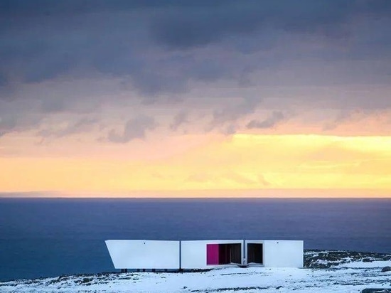 A timber-clad viewpoint designed by Biotope opens in Norway's arctic landscape