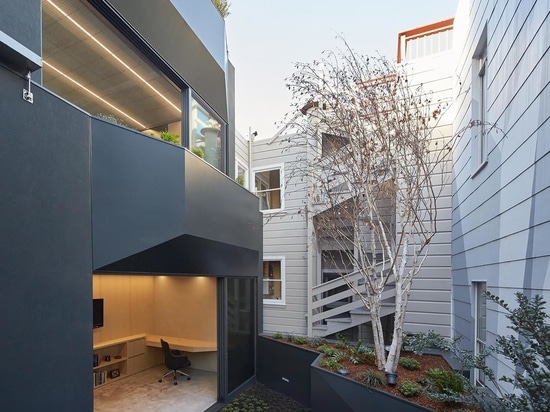 The Wood Exterior Of This Home Hides A Remarkable Blue Staircase Inside