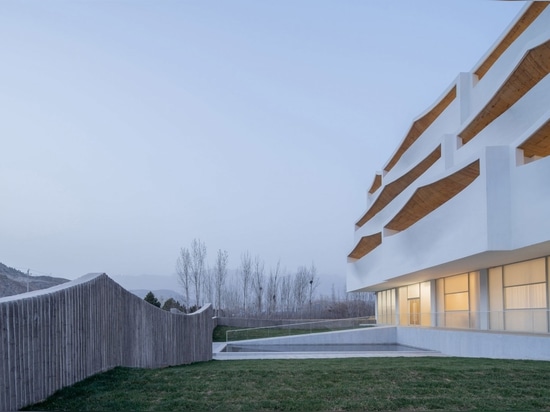 A fence mimics the shape of the terraces