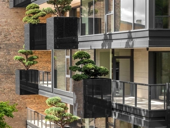 Planters Filled With Bonsai Trees Cover The Exterior Of This Building