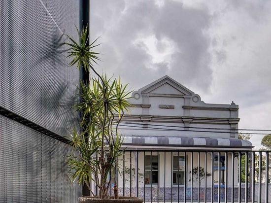 Glazed Black Tiles Present A Sophisticated Exterior For This Home That Used To Be A Warehouse