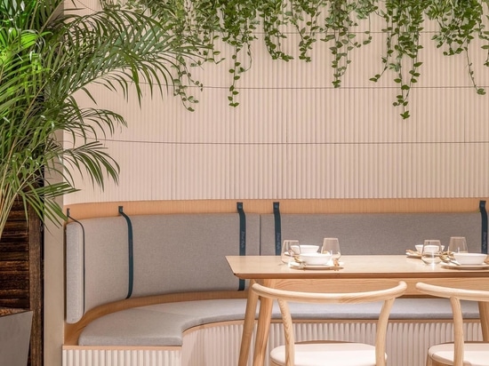 A Grid-Shaped Wood Ceiling Covers This Cafe In China