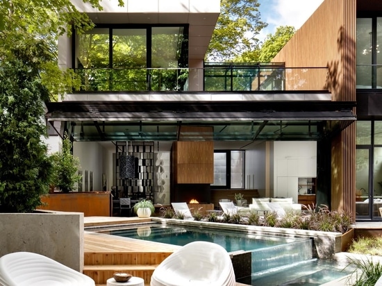 A 40 Foot Glass Wall Folds Open To Connect The Interior And Exterior Spaces Of This Home