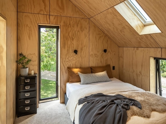 This Small House Is Completely Covered In Wood Shingles