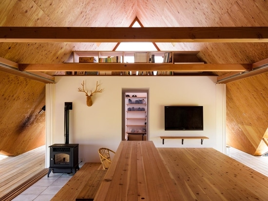 Multiple A-Frame Openings Add Light And Ventilation To This Home With A Wood-Lined Interior