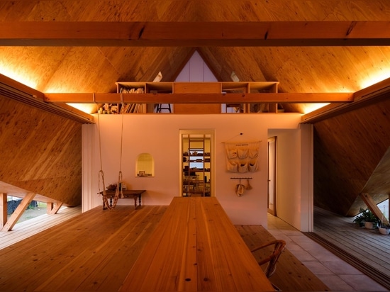 Multiple A-Frame Openings Add Light And Ventilation To This Home With A Wood-Lined Interior