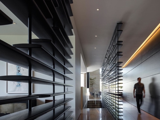 Large Wood Screens Were Designed To Protect The Windows On This Home In California